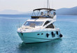 © murmakova - Luxury yacht in azure seas parked in a beautiful blue bay. Modern white Yacht in the sea around island on Croatia.