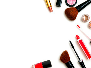 cosmetics top view on a white table. Workplace, cosmetics, lipstick