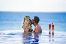 Honeymoon Romantic Lovers Vacation On A Tropical Beach. Young Happy Lovers On Romantic Travel Honeymoon Having Fun On Vacation Summer Holidays Romance.
