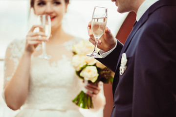 Wall Mural - The brides ekeeping a glass of champagne