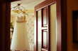 The wedding dress hang on the hanger