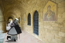 Medieval Knight Praying In Cloistered In Filerimos Monastery In Rhodes Island Built By The Knights Of Saint John, Greece