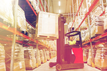 Wall Mural - man on forklift loading cargo at warehouse