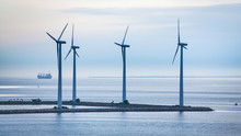 Turbines On Island Of Offshore Wind Farm