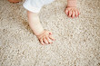 © Syda Productions - hands of baby crawling on floor or carpet