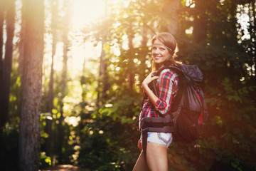 Wall Mural - female backpacker set out on forest trail