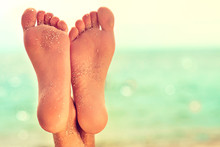 Perfect Clean Female Feet With Sea Sand On The Beach . Spa ,scrub And Foot Care . Foot Massage . 