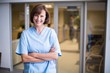 © WavebreakMediaMicro - Portrait of smiling nurse standing with arms crossed
