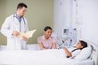 © WavebreakMediaMicro - Doctor and nurse interacting with girl patient