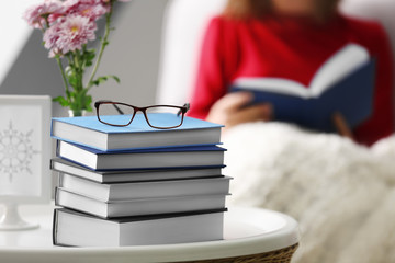 Canvas Print - Pile of books on little table, closeup