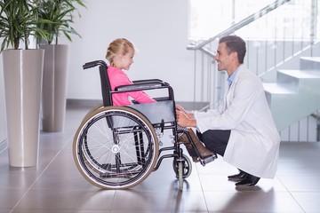 Poster - Smiling doctor talking to disable girl