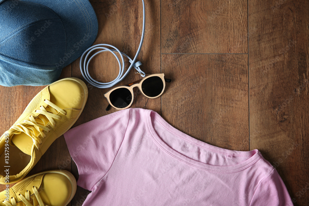 Stylish clothing on wooden floor