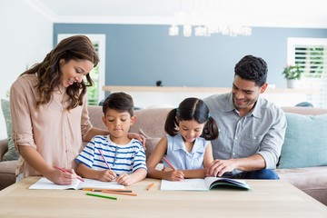 Wall Mural - Parents assisting their kids in doing homework