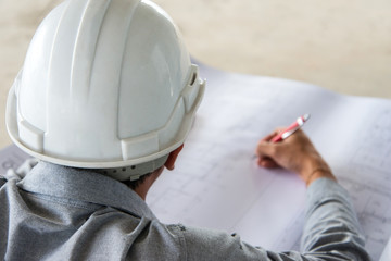 Architect checking detail a construction project.