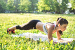 © Bojan - Young attractive sportswoman doing plank exercises on yoga mat outdoor. Healthy lifestyle.