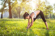 © Bojan - Young health woman doing stretching exercise relaxing and warm up after jogging and running in park.