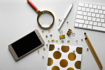 Poster - Workplace with keyboard, smart phone and golden stationery on light background