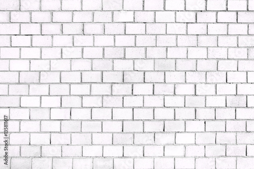 Fotografia Old brick wall, the white surface of the stone blocks