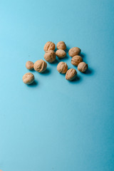 Wall Mural - Walnuts, walnuts close-up, walnuts on blue background,