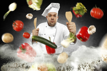 Cook chef and fresh vegetables 