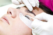 © lester120 - Woman on the procedure for eyelash extensions, eyelashes lamination