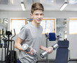© lester120 - Teenage boy engaged in the gym hall