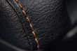 Car leather texture with stitch. Interior detail. Macro photo.