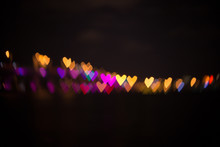 Heart Bokeh Background. Big City Night View On A Miami Downtown, Bay And Bridge. Valentine's Day Background Macarthur Causeway Purple At Night - Miami Downtown Florida