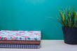 © miracoure - Green Plant,Books on wooden table with copy space.Green background.