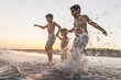 © Jasmin Merdan - Fun kids playing splash at beach