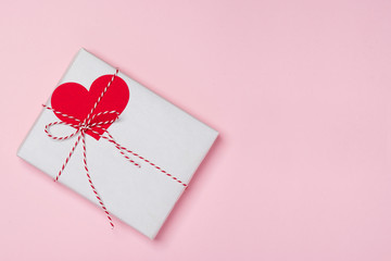 Sticker - Valentines day composition: gift box with bow and hearts on red