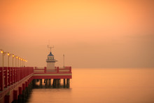 Scenic View Red Pier At Sunrise In Thailand.