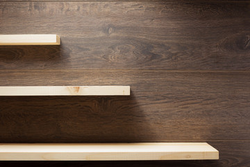 Poster - wooden shelf at brown background