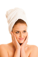 woman with towel on her hair holds hands next to her face - conc