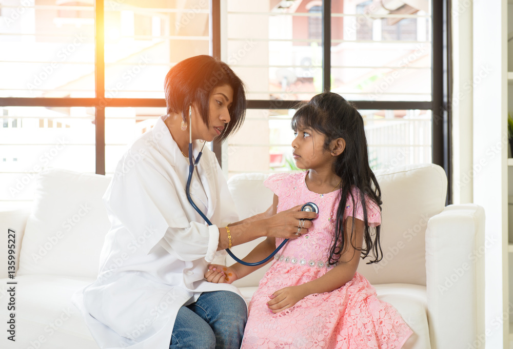 indian female doctor treating young girl patient Stock Photo | Adobe Stock