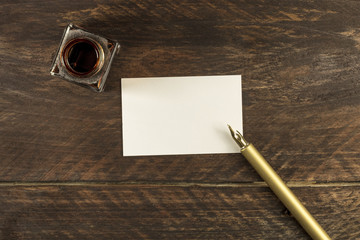 Wall Mural - Blank white business card with ink pen and bottle