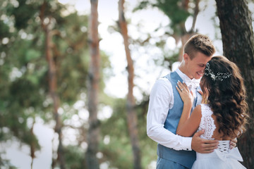 Wall Mural - Beautiful wedding couple outdoors on blurred background, close up view