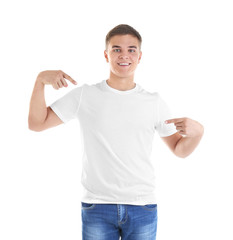 Wall Mural - Handsome young man in blank t-shirt on white background