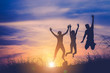 © Panumas - The silhouette of three people jumping with sunset background. f