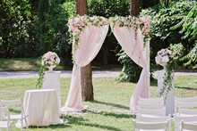 Arch For The Wedding Ceremony, Decorated With Cloth And Flowers