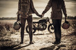 © Nejron Photo - Young, stylish cafe racer couple and vintage custom motorcycles in field