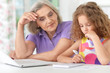 © aletia2011 - grandmother and granddaughter doing homework