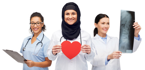 Wall Mural - happy doctors with red heart, x-ray and clipboard