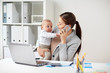© Syda Productions - businesswoman with baby and smartphone at office