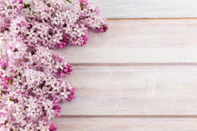 Purple Lilac Flowers On Wooden Table