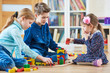 © Kadmy - children playing with blocks indoors