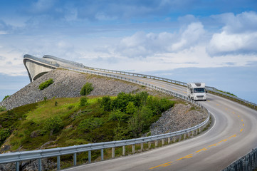 Camper at famous Atlantic Road curved bridge, Norway.