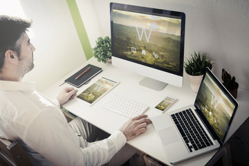 Wall Mural - man working with devices