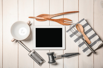 Canvas Print - Kitchen utensils with tablet on wooden table