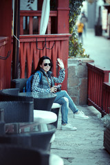 Portrait of smiling female with vintage camera discovering